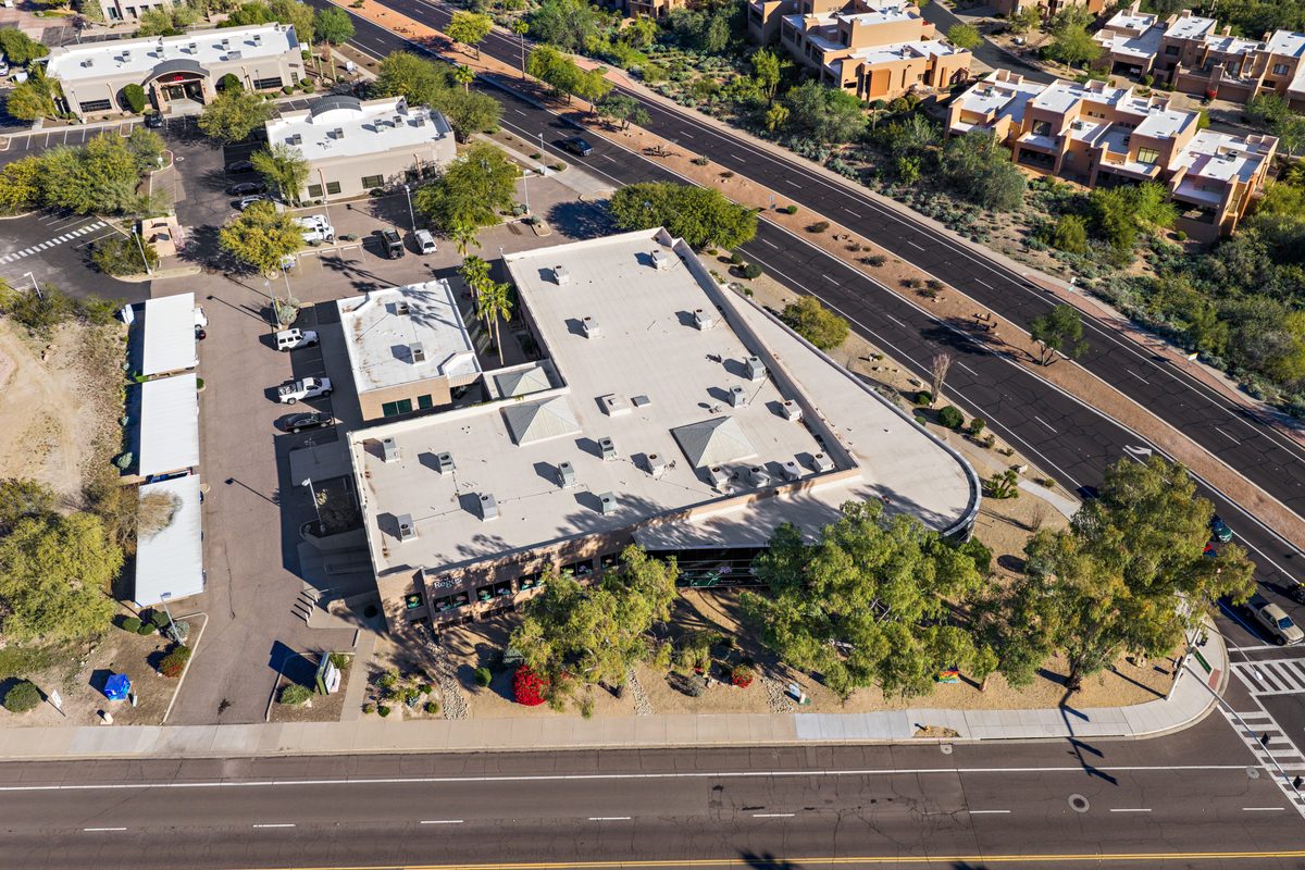 Overhead view of the building and surface parking